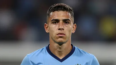 Photorealistic head-and-shoulders shot of a lean, 22-year-old Brazilian winger in a solid sky-blue kit, smooth fabric texture