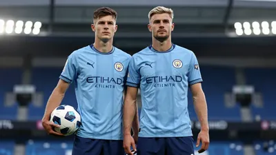 Mid-20s anonymous Manchester City midfielder, athletic build, waist-up, intense gaze, sky-blue shirt with navy sleeves...